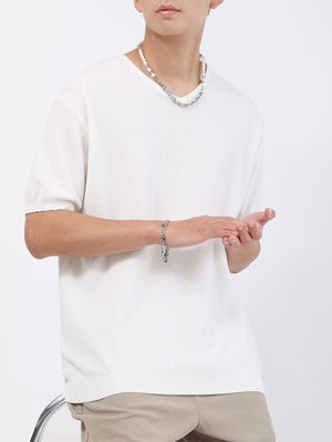Men's white casual knit t-shirt with a textured weave and short sleeves.