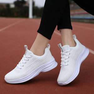 White textured knit performance runners with white laces and soles.