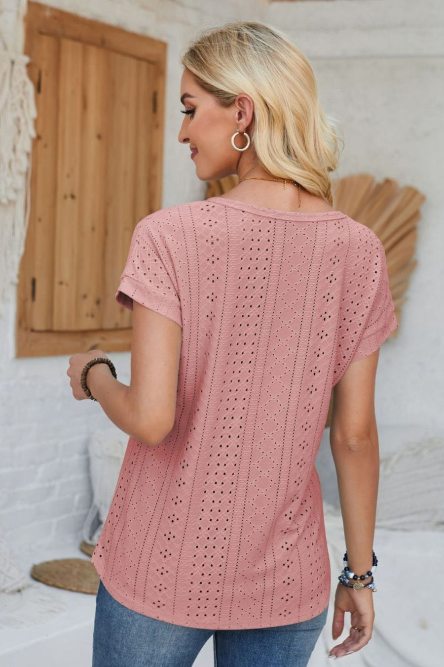 Perforated eyelet cuffed tee in blush pink with short sleeves and a relaxed fit.