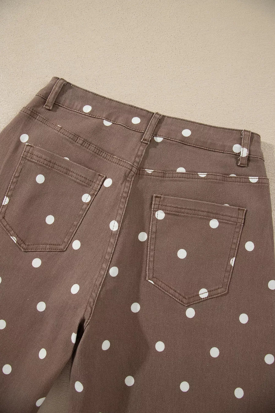 white jeans with zip-front and polka dot