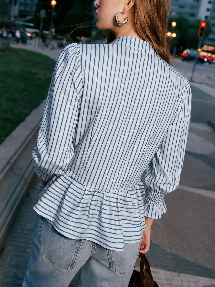 white peplum top with smocked and long sleeve