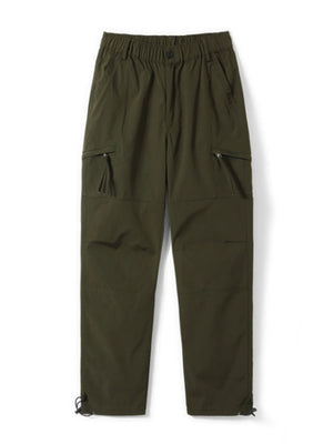 Relaxed fit green cargo pants with multiple zippered pockets and adjustable ankle cuffs.