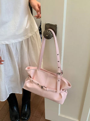 Pink shoulder bag with buckle and woven