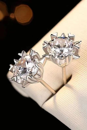 Silver celestial cut moissanite stud earrings with a bright, sparkling diamond.