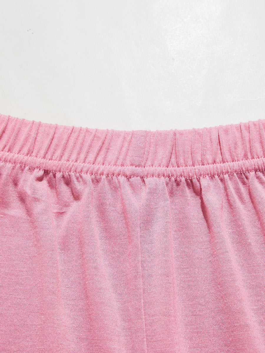 Pink lounge set shorts with elastic waistband and lace trim detail.