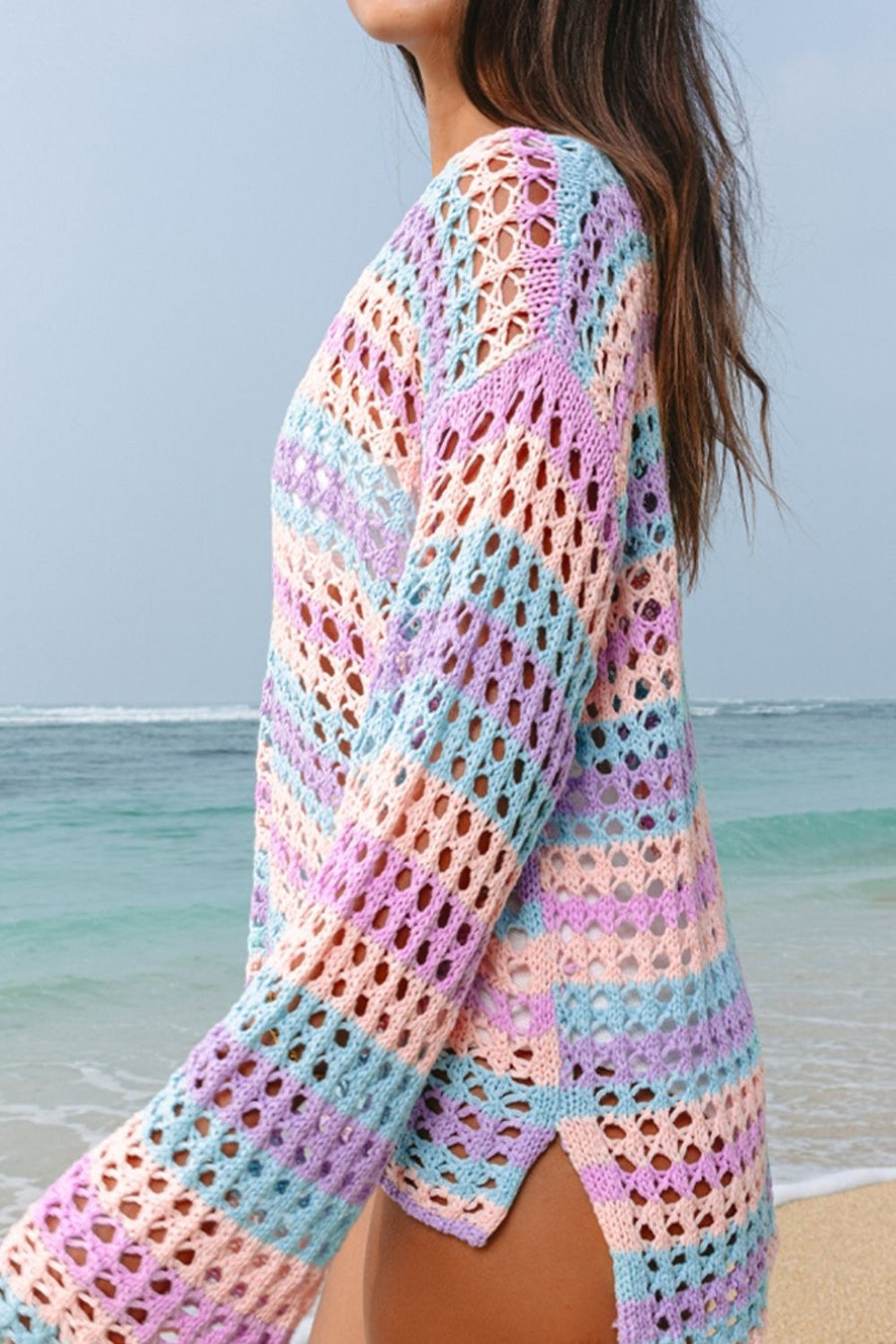 Pastel crochet beach cover-up with stripes in lavender, blue, and peach.