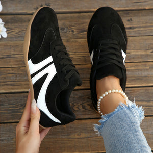 beige sneakers featuring round toe and color-block