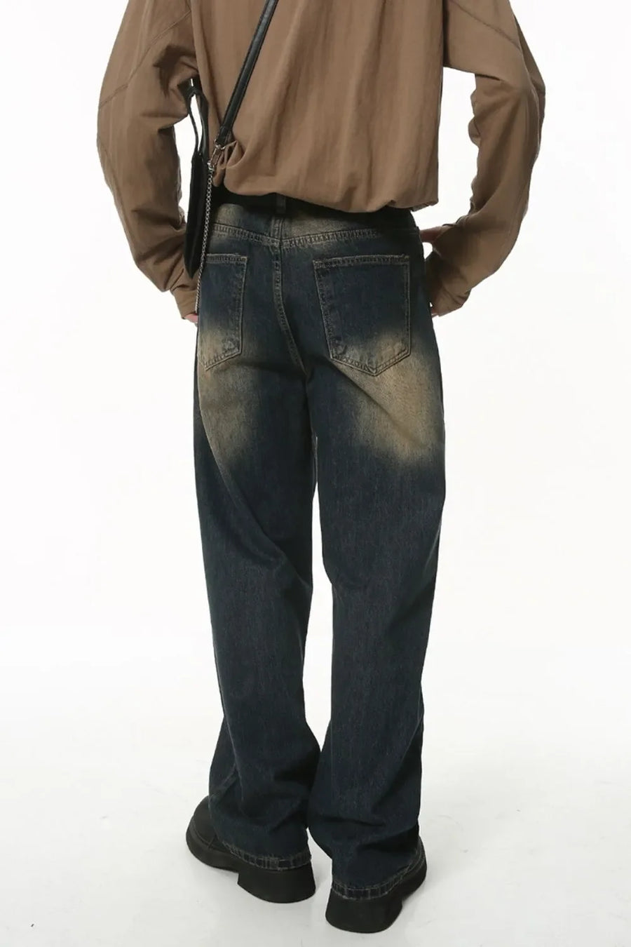 Faded wash baggy denim jeans in dark wash with a relaxed fit.