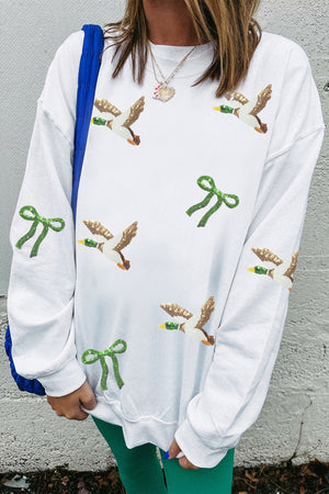 50% polyester, 50% cotton Care instructions: Machine wash cold pullover sweater in cream with relaxed silhouette