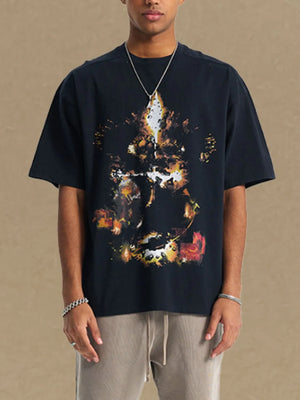 Black oversized t-shirt with abstract fiery graphic print and crew neck.
