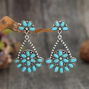 Silver Southwestern turquoise floral dangle earrings with boho style.