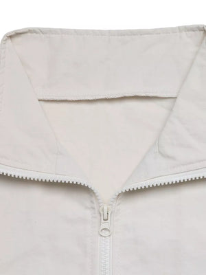 athleisure windbreaker in Apricot with collared