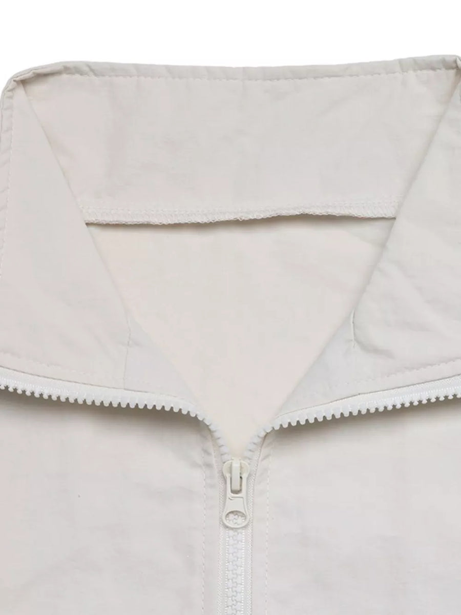 athleisure windbreaker in Apricot with collared