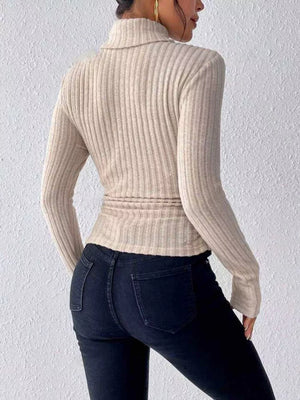 Khaki ribbed turtleneck long sleeve tee with a cinched waist detail.