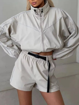 dark brown track jacket with drawstring waist and long sleeve