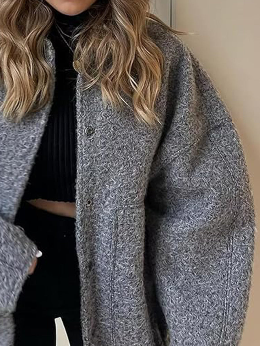 Dark Gray bouclé cocoon jacket with snap closure and textured material.