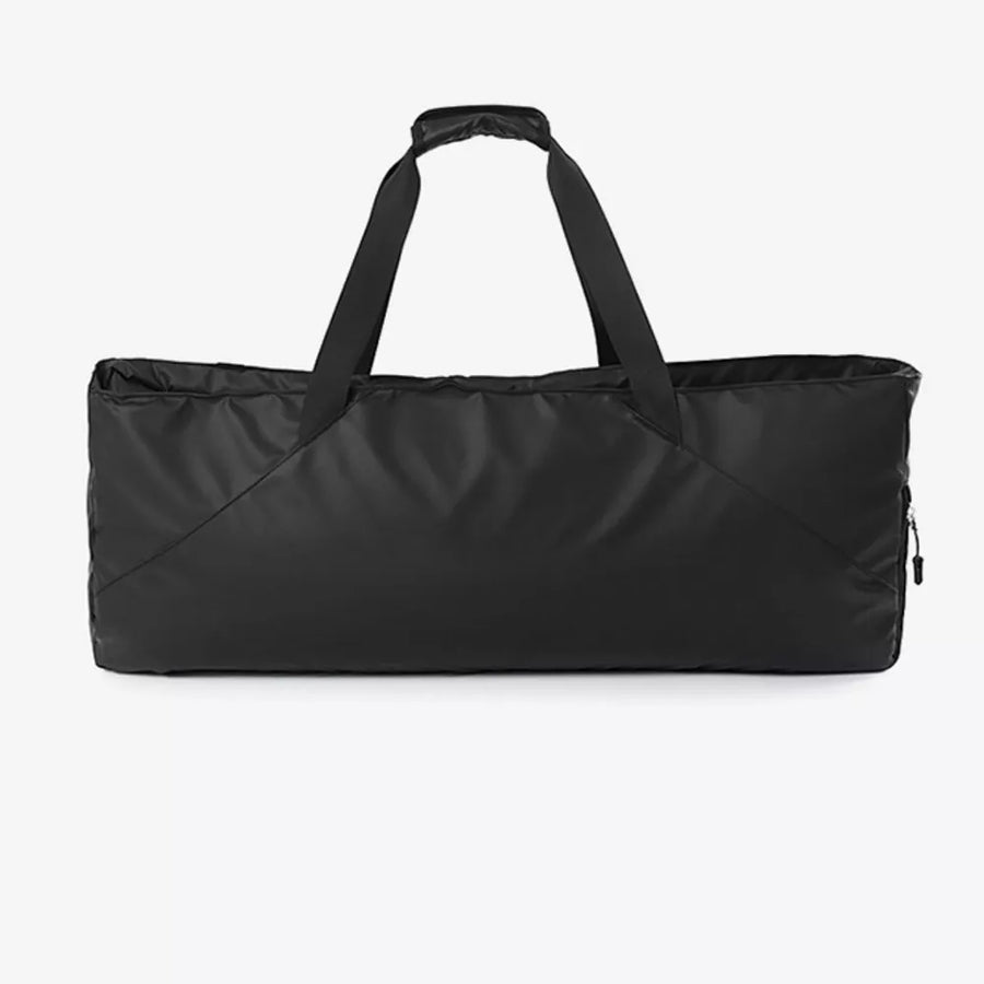 Black color block travel bag with dual handles and a zippered side pocket.