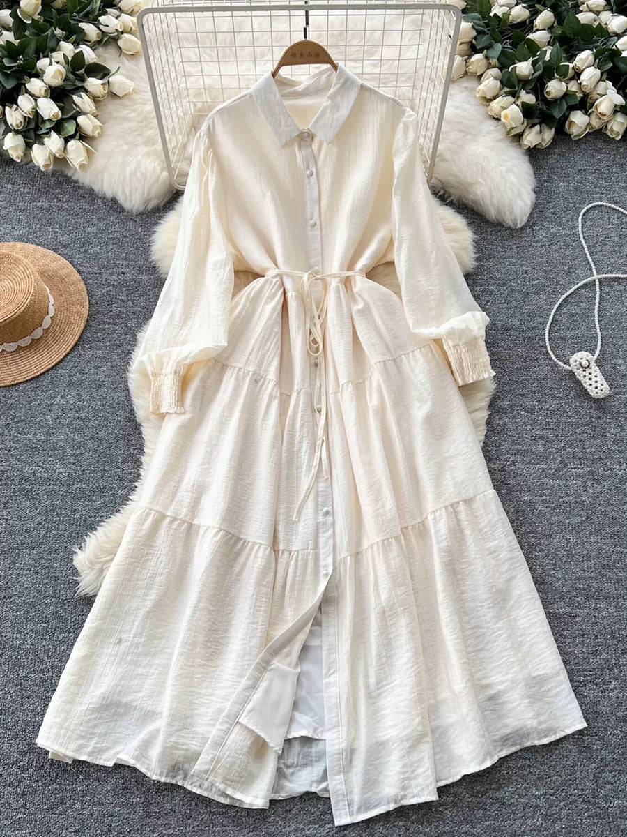 Off-white textured tiered long sleeve button-down dress with tie waist
