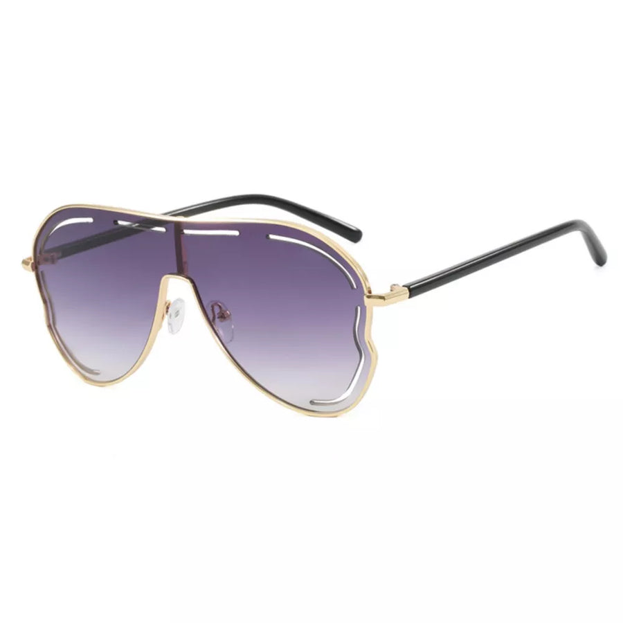 Statement aviator sunglasses with gold metal frames and purple gradient lenses.