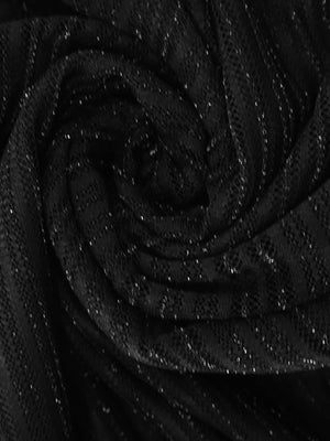 Black lace mini dress with glitter accents and a boat neckline.