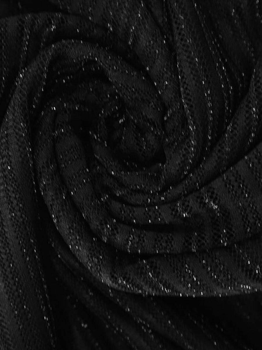 Black lace mini dress with glitter accents and a boat neckline.