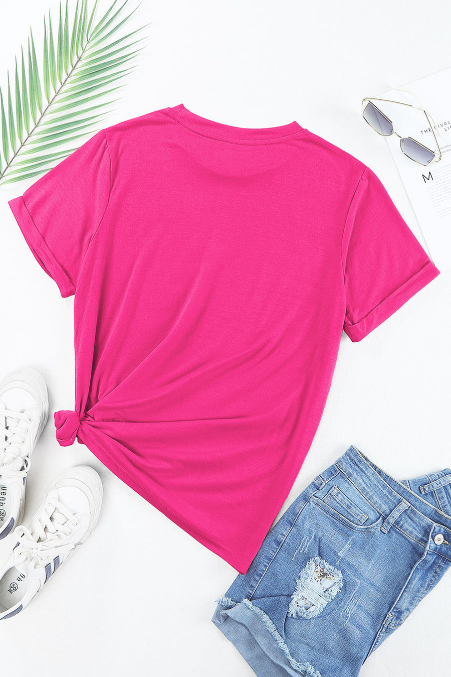 Hot Pink t-shirt with rolled sleeves and a knotted hem, styled with denim shorts.