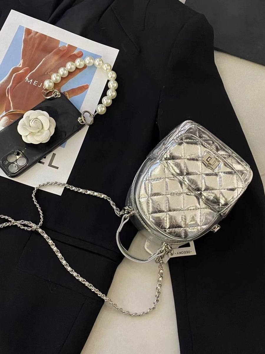 backpack featuring quilted in Silver with PU Leather Imported Size & texture