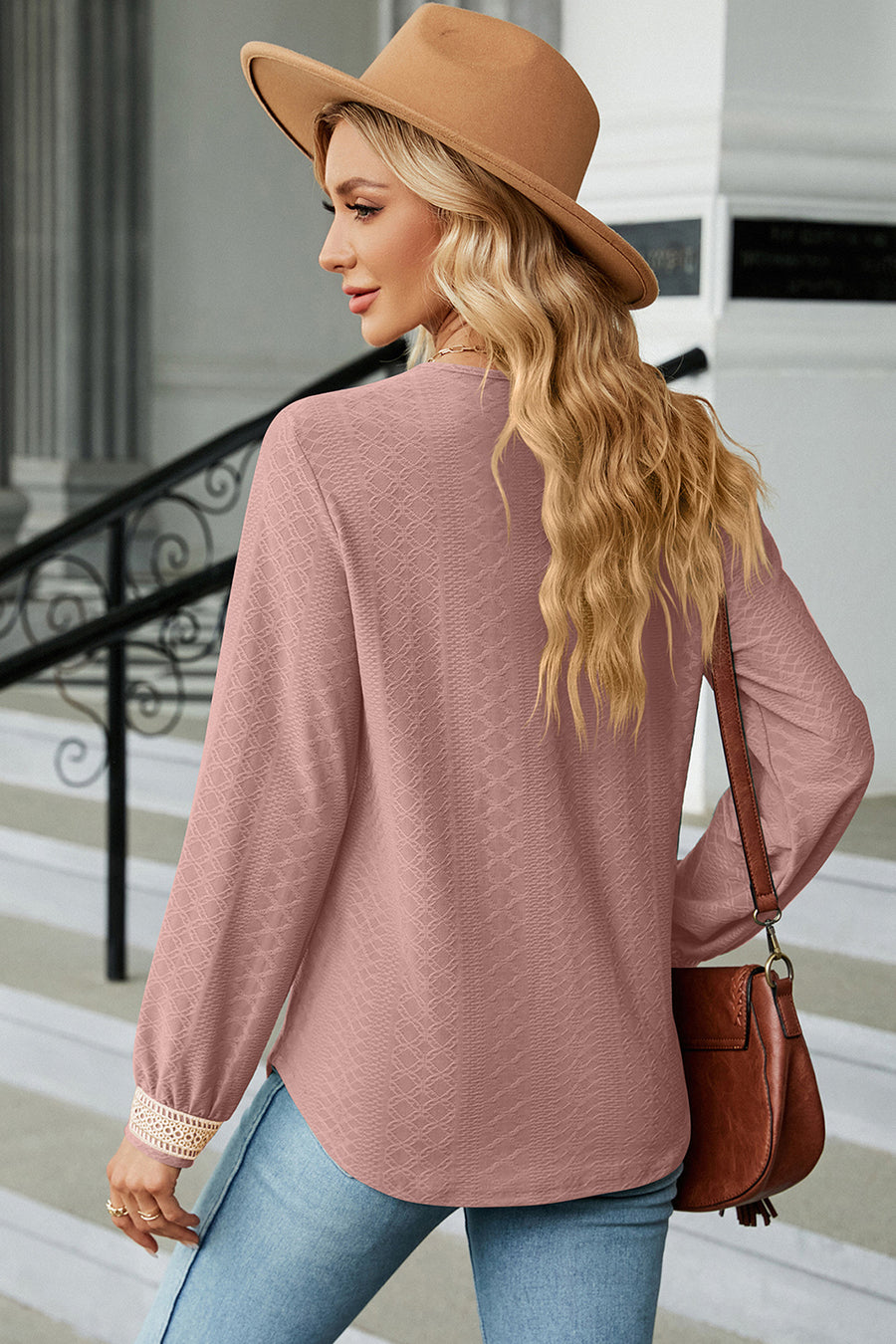 Dusty Pink textured blouse with lace trim cuffs and V-neck.
