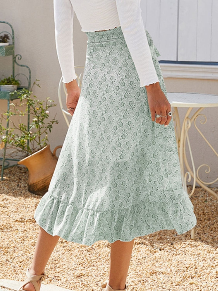 Asymmetric wrap skirt in Gum Leaf with a delicate leaf print and ruffled hem.