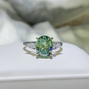 ring in green featuring oval cut moissanite and classic fit