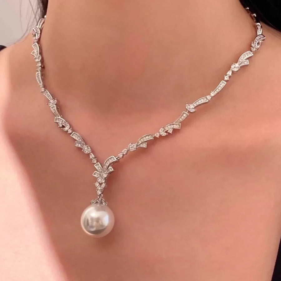Synthetic Pearl,Alloy,Zircon Care instructions: Avoid wearing during exercise, a necklace in Silver with straight silhouette