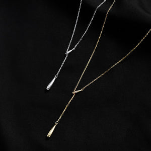 Y-shaped pendant necklace in gold and silver with teardrop charms.