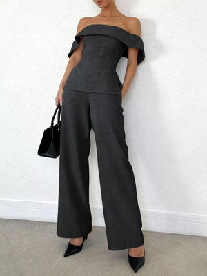 Dark gray off-shoulder top and wide-leg pants set with ruffled sleeves.