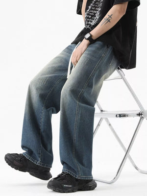 Vintage wash oversized wide-leg jeans in light blue with distressed details and a drawstring.