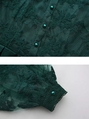 Green lace maxi dress with button front and lantern sleeves.