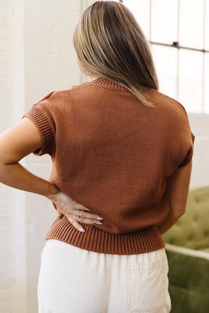white pullover sweater featuring stretch and graphic