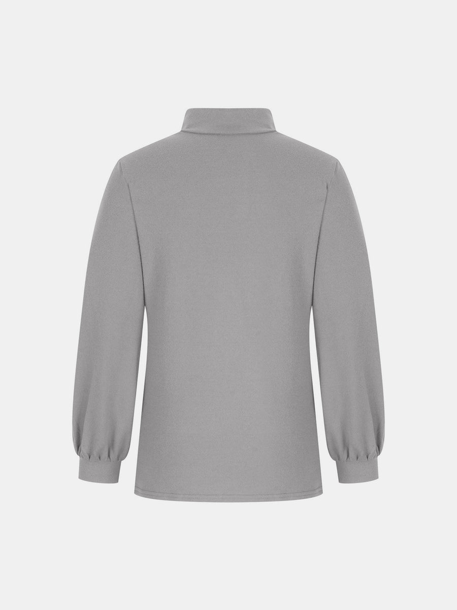 Gray mock neck top with puff sleeves and button back detail