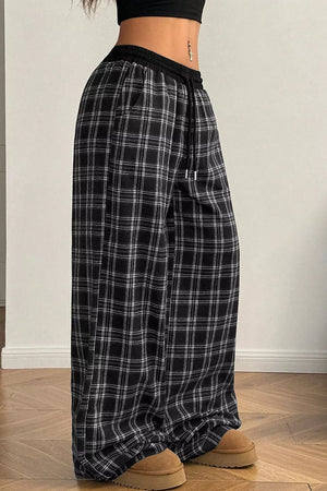 white wide-leg pants featuring drawstring waist and plaid