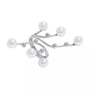 Silver bypass ring with pearls and small metal beads on a gold-plated alloy band.