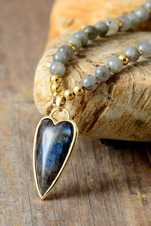 Bead pendant necklace with heart-shaped labradorite and gold accents.