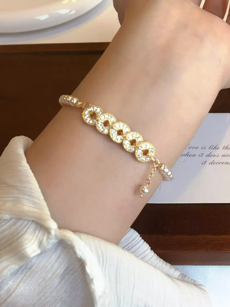 gold ACCESSORIES featuring pearl accents and geometric