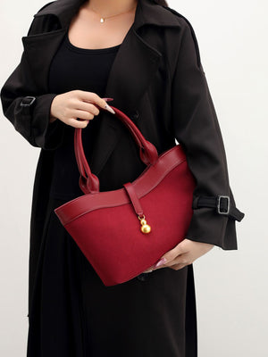 Suede Crossbody Bag With Gold Charm in burgundy with adjustable strap
