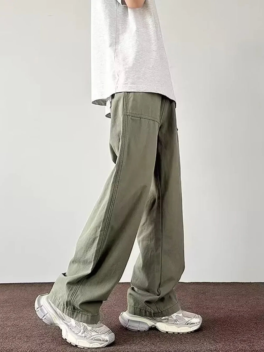 Men's green casual wide-leg cargo pants with visible stitching details.