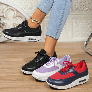 Black, red, and purple lace-up wedge sneakers with breathable mesh and cushioned soles.