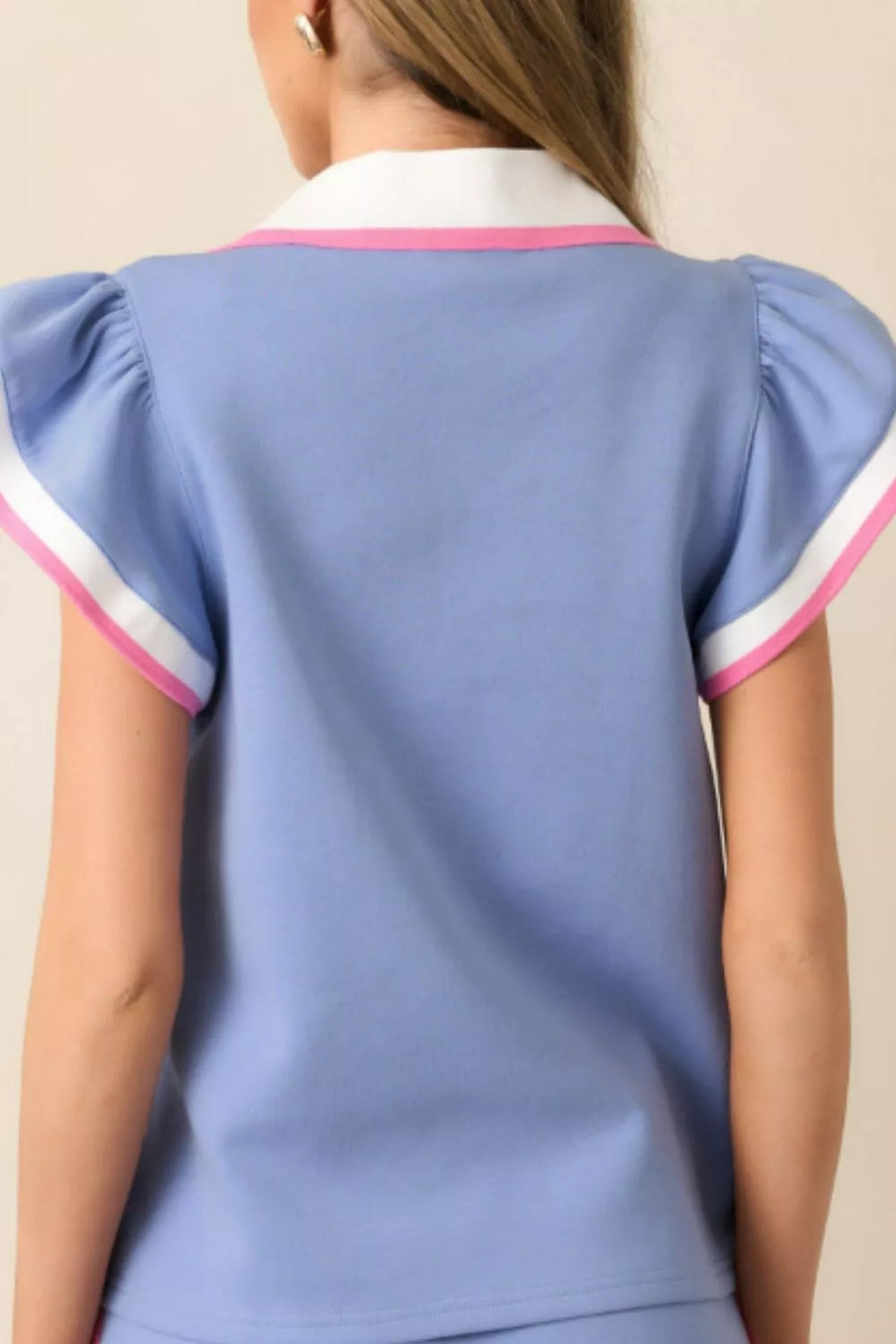 Blue polo tee with pink and white trim, puff sleeves, and matching drawstring skirt.