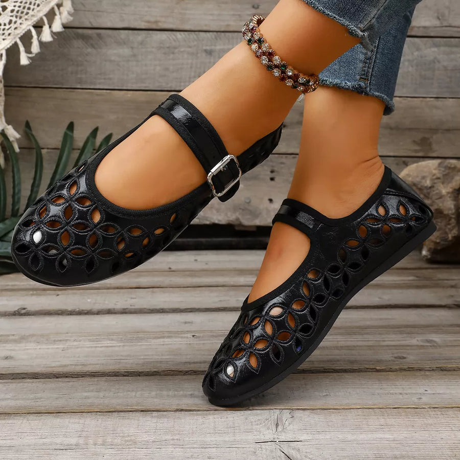 Silver flats featuring round toe and floral