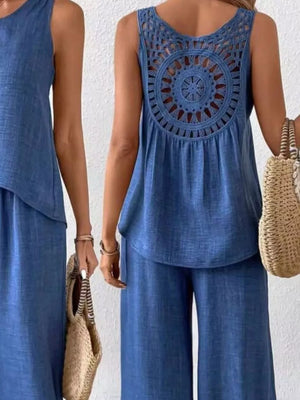 Dark blue two-piece set with round neck tank and wide-leg pants, featuring a crochet cutout detail on the back.