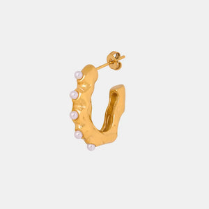 Gold hoop earrings with sculpted texture and pearl accents