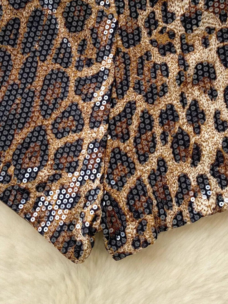 Radiant animal print sequin chino shorts with a leopard pattern.