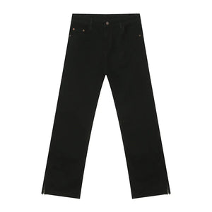 Black denim jeans with a split hem detail